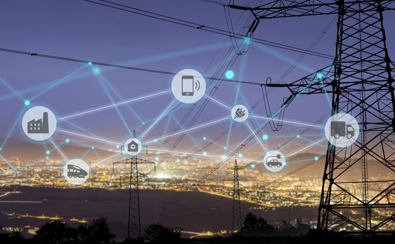 Un paysage de services publics électriques la nuit avec des bulles IoT.